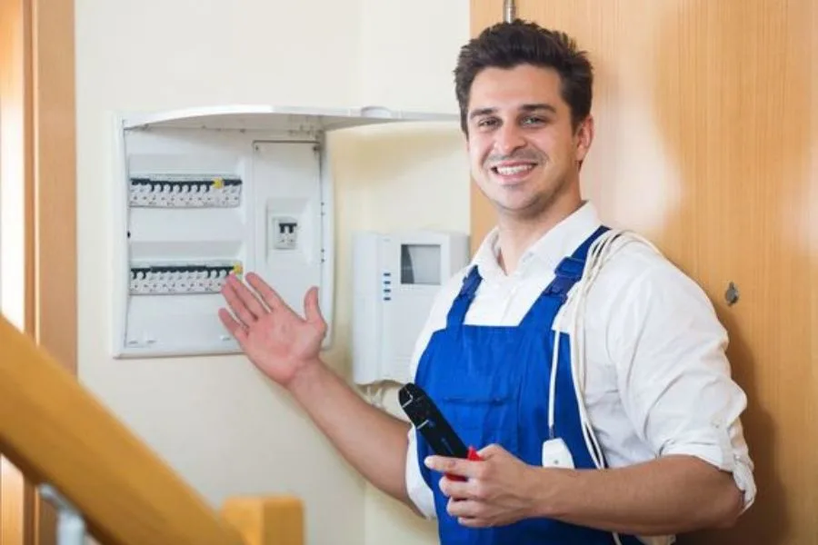 electrician in windsor repairing a home breaker box